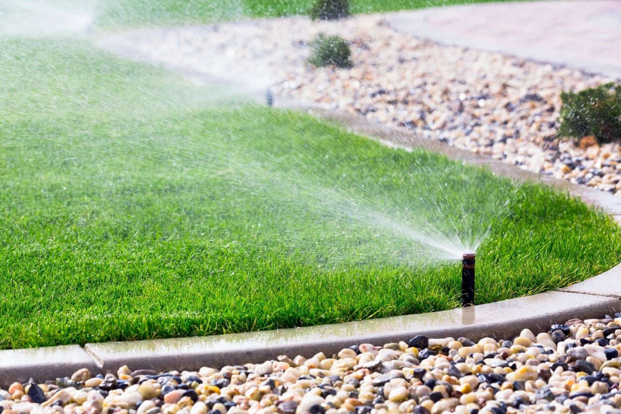 Automatic sprinklers watering lawn